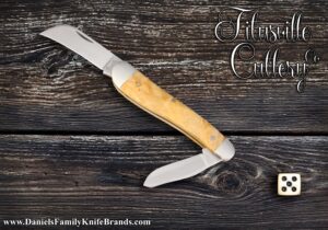 2025 Titusville Cutlery Rooster Comb Golden Maple Burl Ad